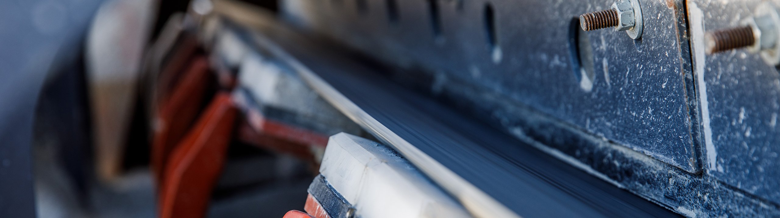 Conveyor load zone sealing system with cartridge pads supporting the belt to prevent sag and maintain a tight seal against skirting
