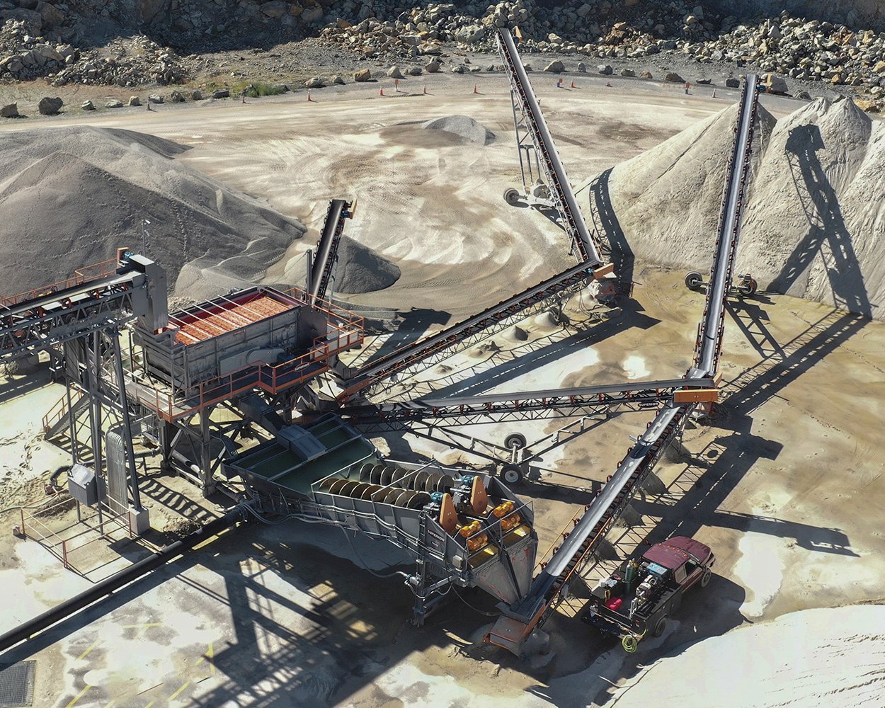 Wet processing plant at Onyx Corporation featuring screen, fine material washer, and conveyors producing specification sand from surplus aggregate