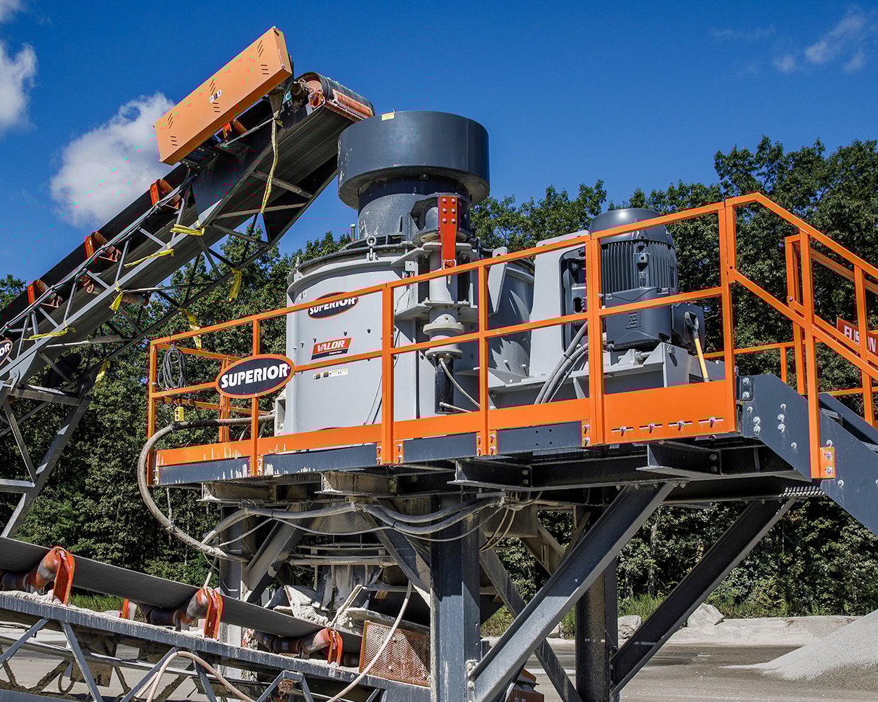 Superior Cemco Valor® VSI crusher on elevated platform, shaping aggregate into specification sand within Onyx Corporation’s processing plant