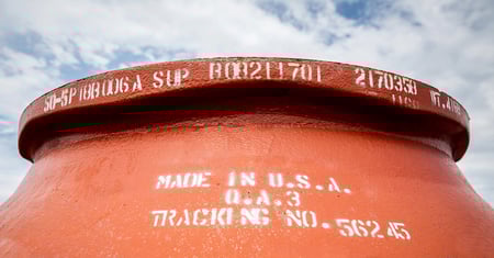 closeup of orange cone liner with stamped white lettering