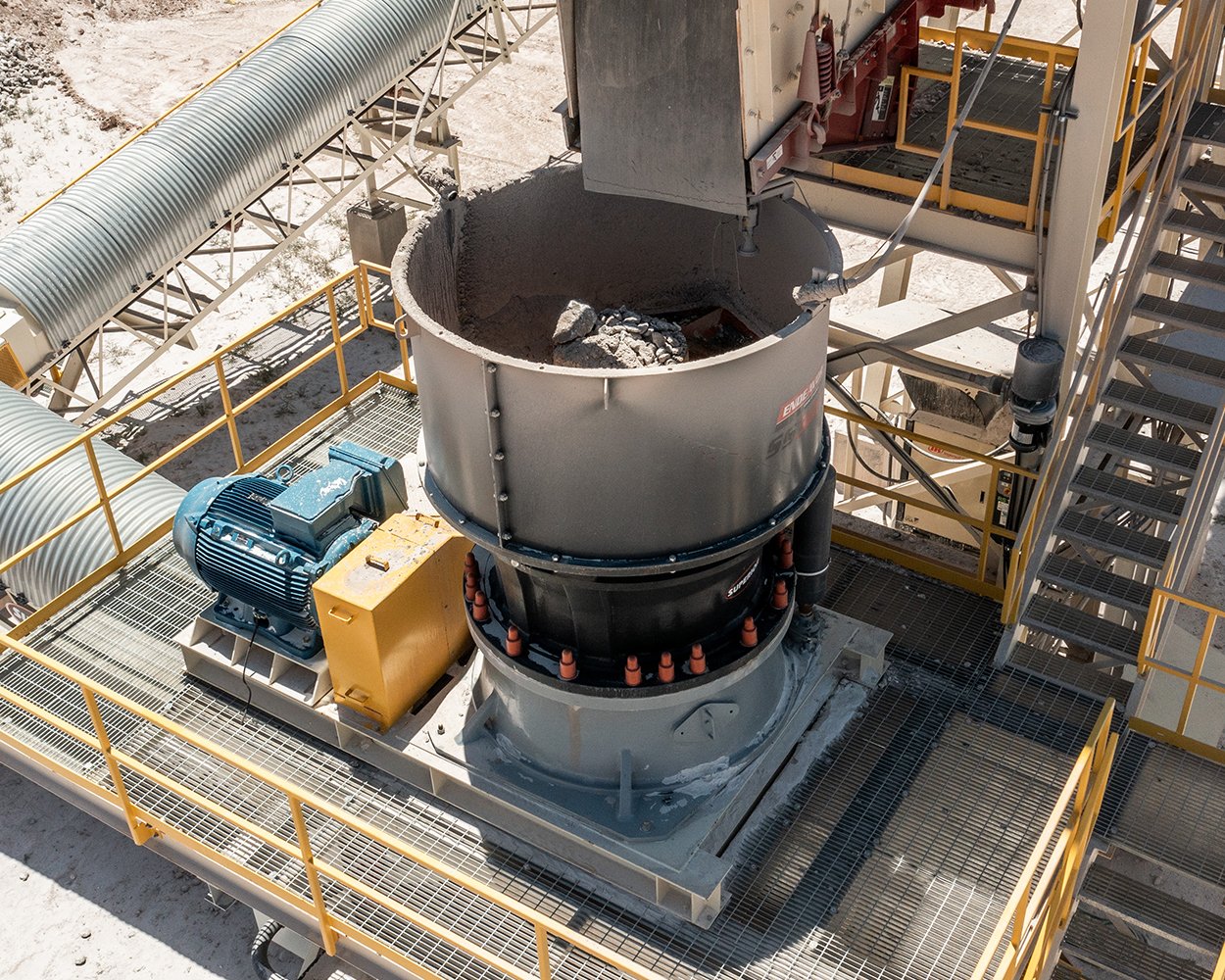 Endeavor® S300 spider bushing cone crusher processing coarse aggregate in a stationary crushing plant