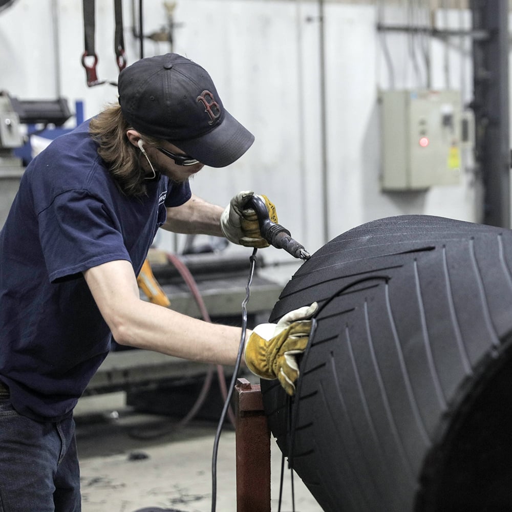 Grooving Lagged Pulley by manufacturer shop worker