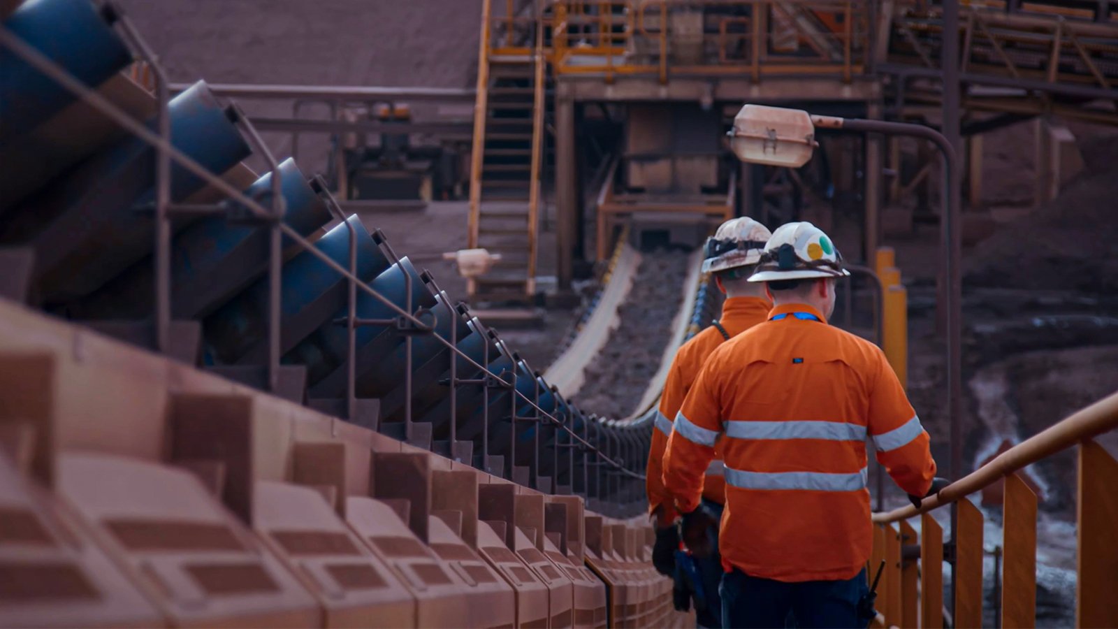 Two Maintenance Men Checking Conveyor