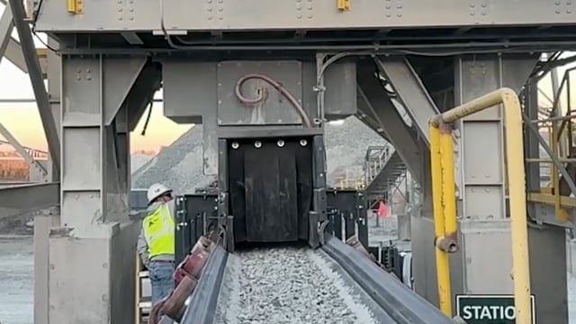 Conveyor load zone after skirting system installation showing contained dust and reduced spillage around the transfer point