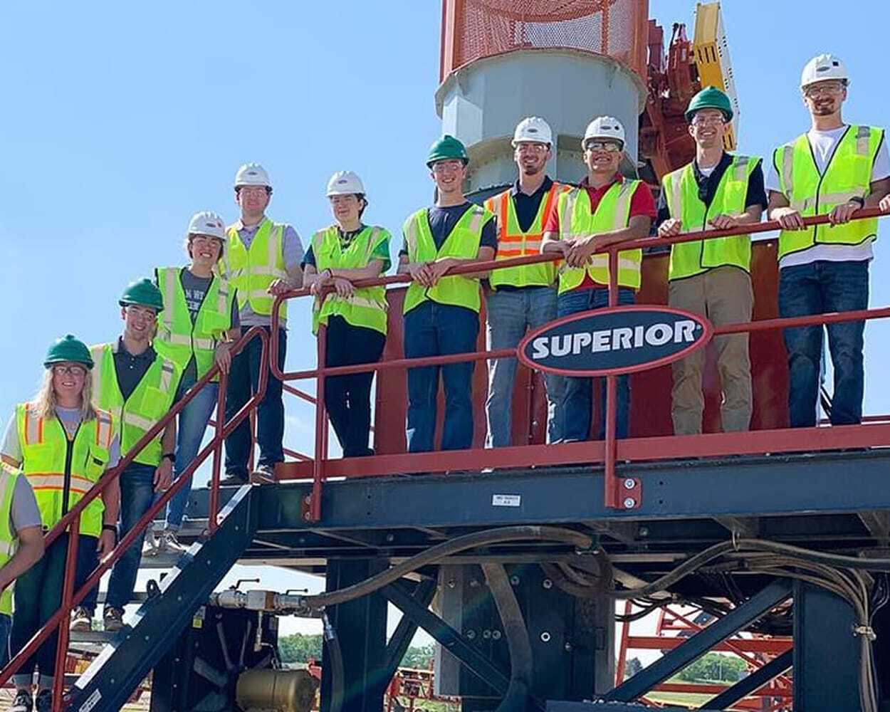 Superior team standing on a walkway together