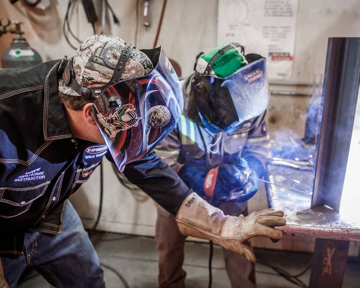 A Superior welding instructor works one-on-one with an employee at the in-house Weld Training Center