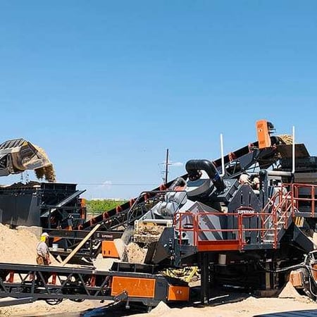 Superior Industries Aggredry portable wash plant in operation, customized for sand production with matched conveyors, feed hopper, and integrated water system
