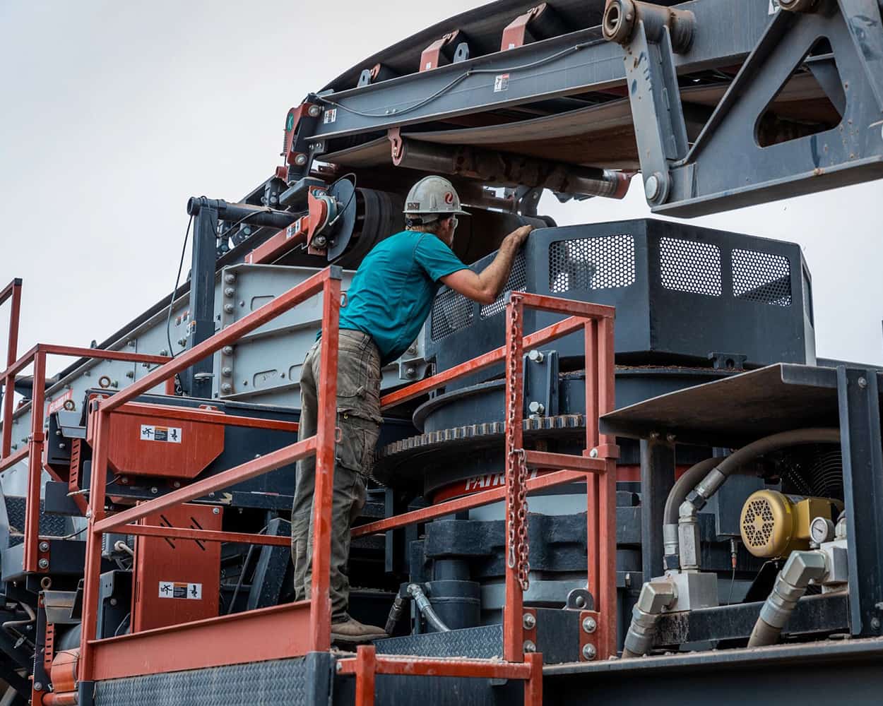 Operator checking status of Portable Patriot Cone CC Plant.