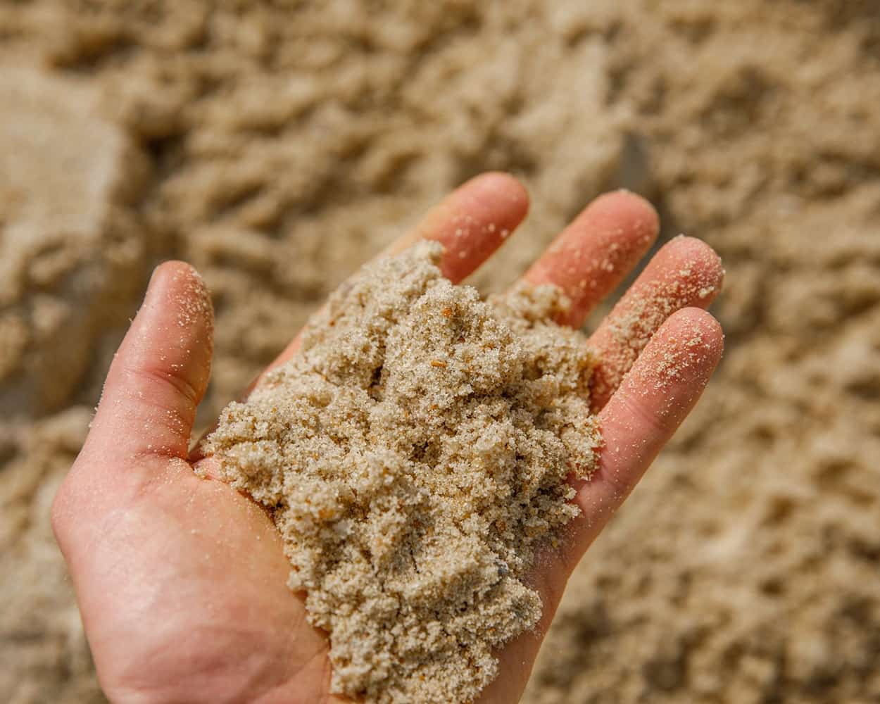 Hand full of sand product from wash plant