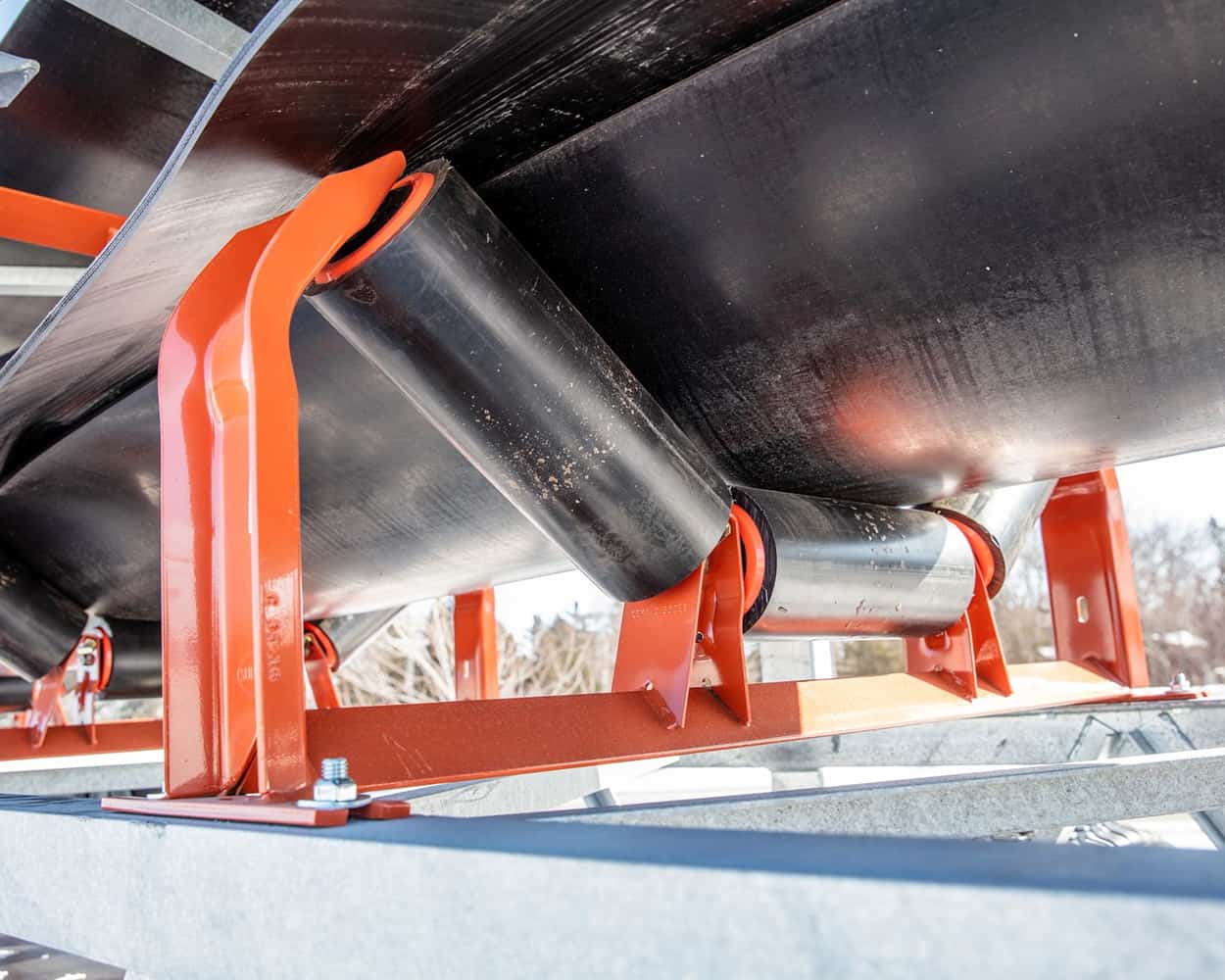 Moxie Idler Rolls in application on conveyor