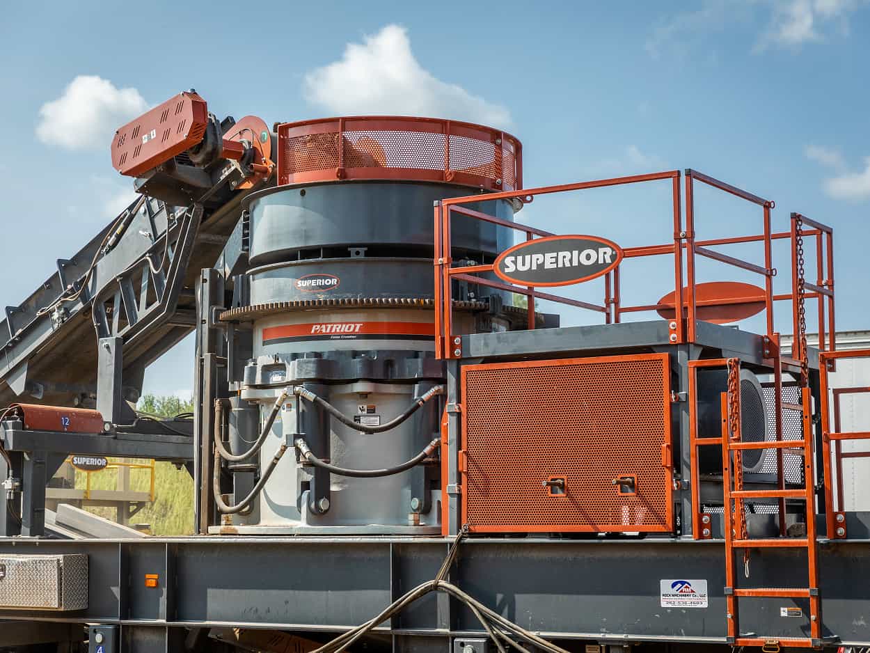 Superior portable crushing and screening plant processing aggregate at a jobsite, with a Patriot® Cone Crusher RFRD Plant