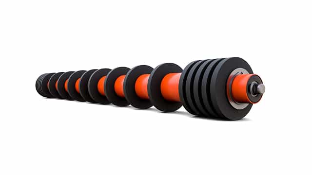 3D rendering of rubber disc return idler with spaced rubber discs engineered to shed carryback and maintain clean belt contact.
