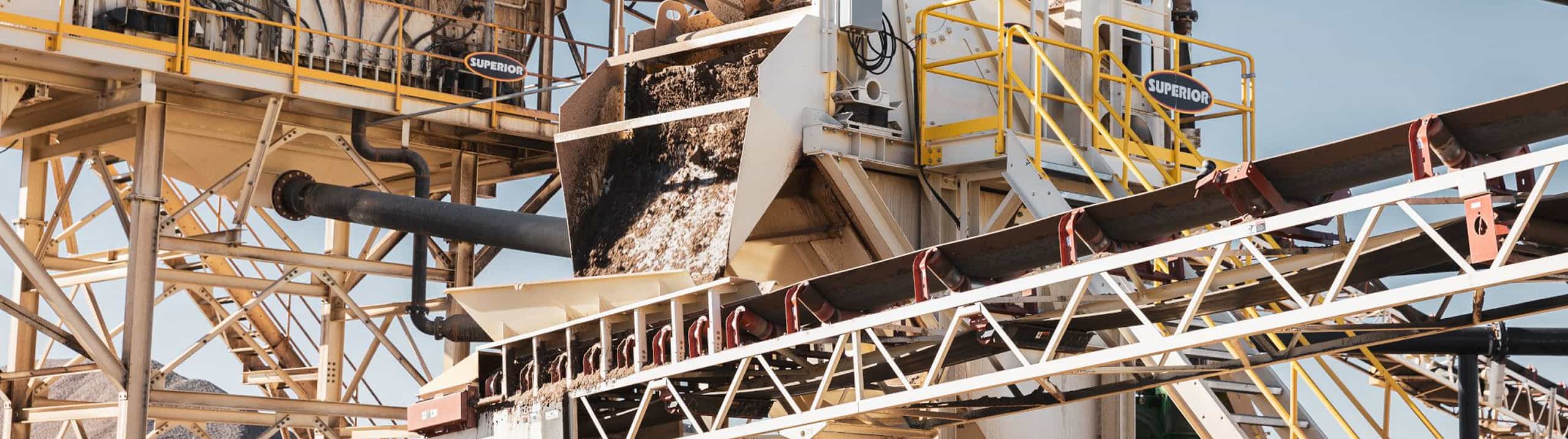 Modular Spirit® Sand Plant dewatering sand with a Helix® cyclone, dewatering screen, sump, and pump on stationary platform