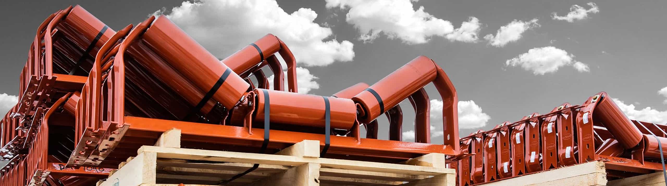 Pile of Superior troughing idlers on pallets