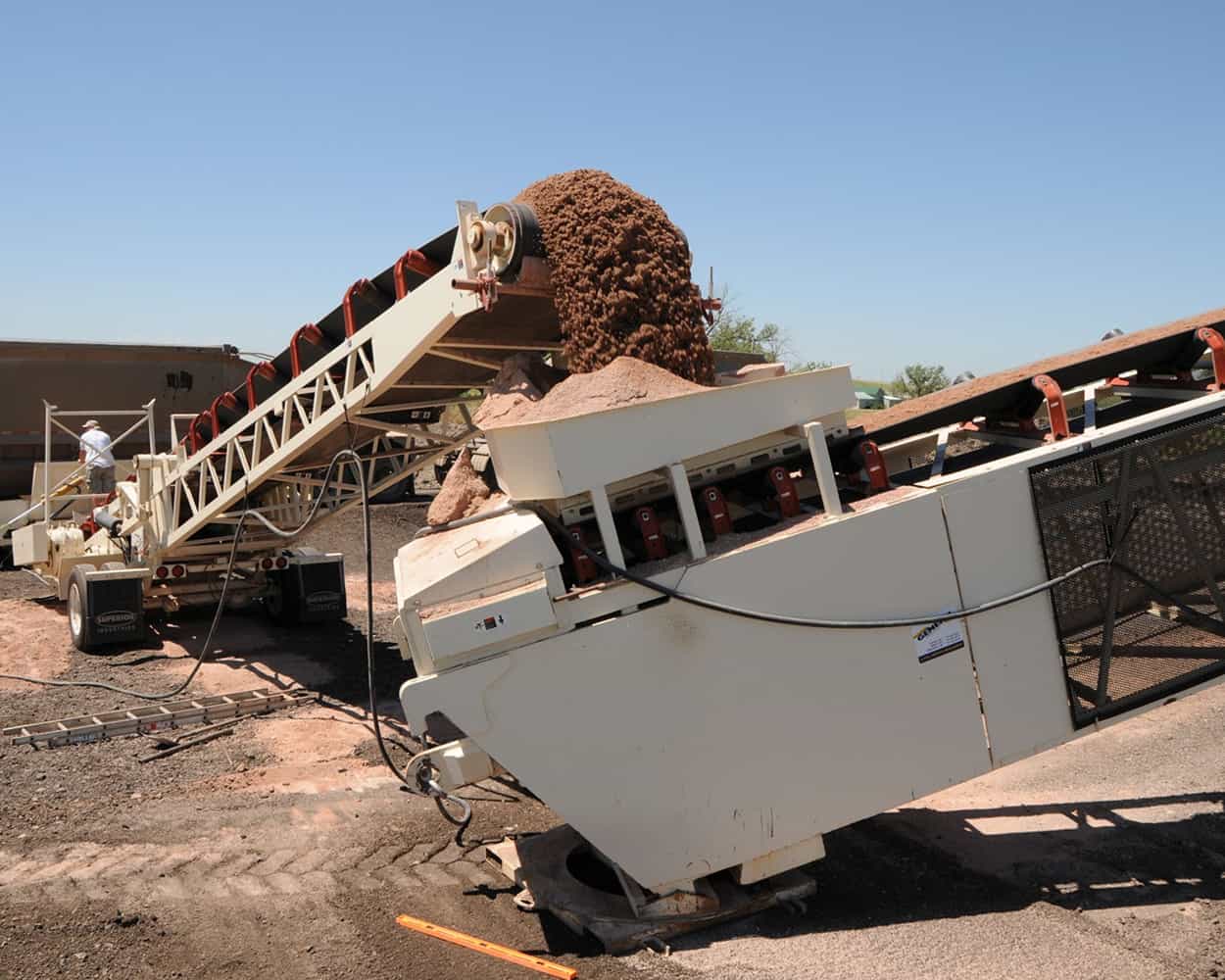 RazerTail® Truck Unloader transferring material to tail end of TeleStacker® Conveyor