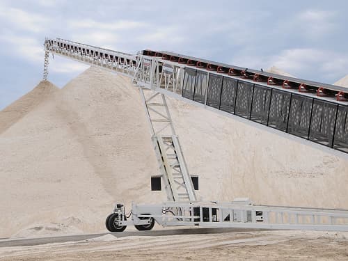 Aggregate Industires with portable radial stacking conveyors