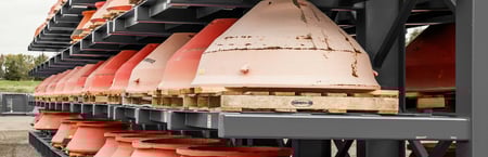 cone crusher liner parts on shelf showing inventory
