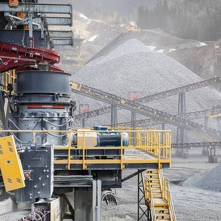 A fully operating aggregate plant featuring Superior crushers and conveyors moving material efficiently across the site