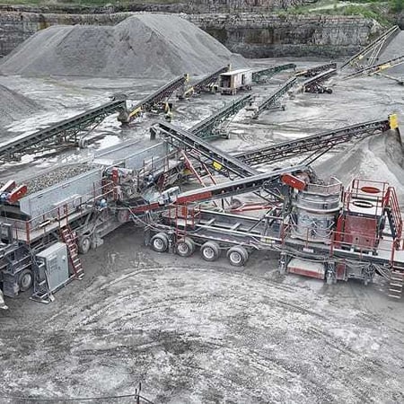 Superior Industries portable cone and screen plants operating together in a quarry, showcasing seamless integration and steady material flow across the circuit