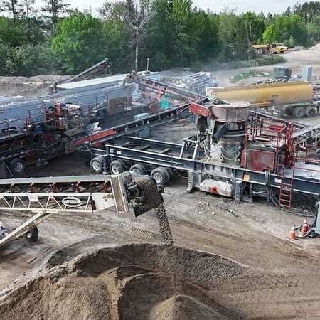 Portable crushing and screening spread from Superior Industries featuring cone, screen, and conveyor systems all built by a single manufacturer for simplified setup and service