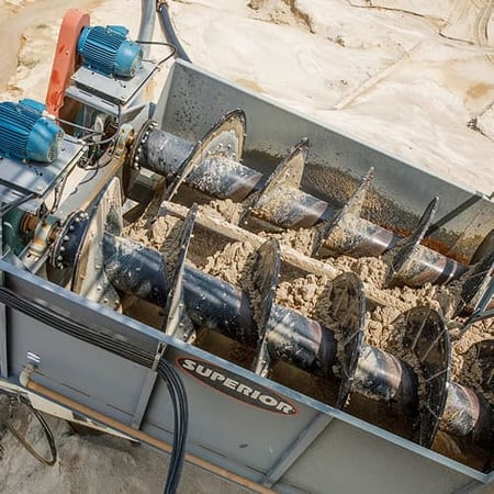 A twin screw washer operating at Mojave Materials in Woodbine, New Jersey, showing the spiral flights and paddles