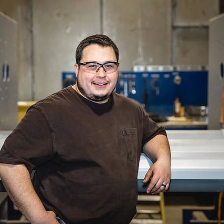 A Superior employee stands in a manufacturing facility in Columbus, Nebraska, representing the skilled team behind the company
