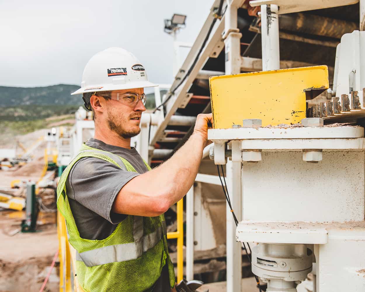 Worker closeup at jaw crusher