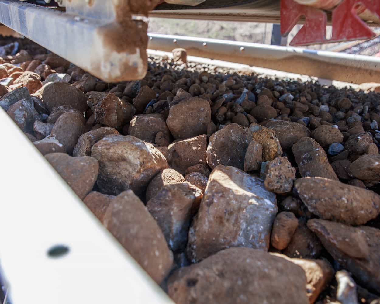 Closeup of rocks getting screened on Patriot Cone Portable CC Plant
