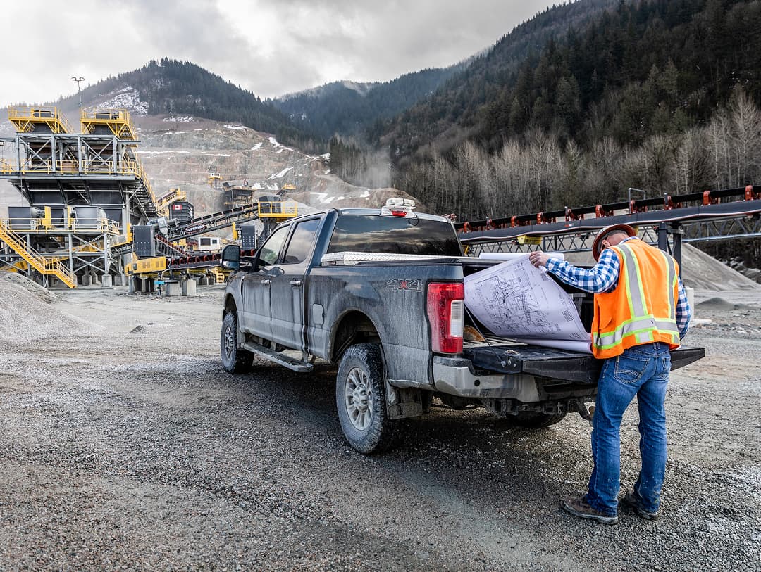 Mainland Construction Summit Materials plant with truck  and worker in foreground
