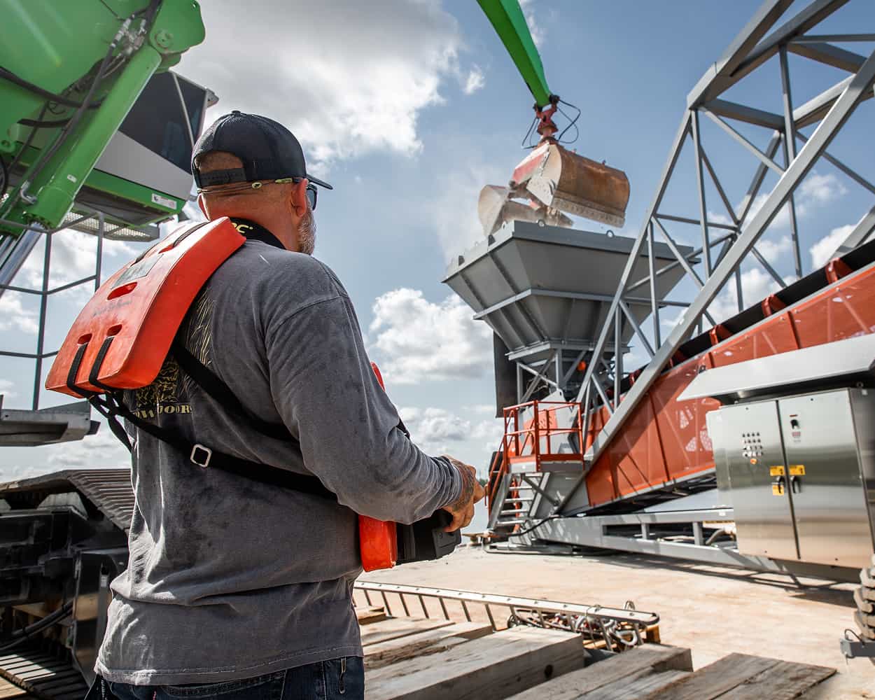 Operator using remote controls on TeleStacker Conveyor at Pontchartrain Materials barge