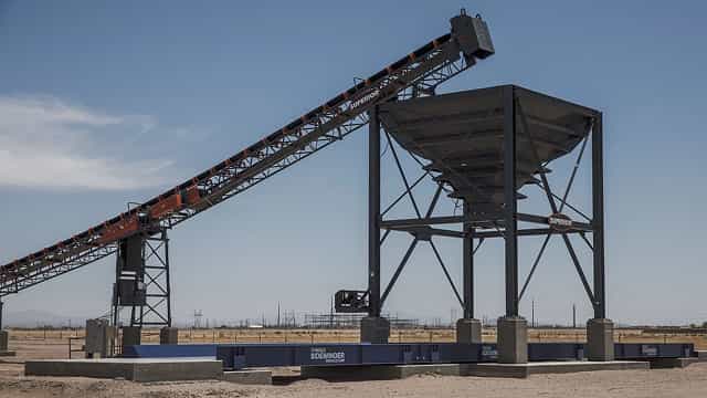 Superior® Feed Hopper and conveyor system at a sand and gravel plant, controlling material flow from the hopper to downstream processing equipment.