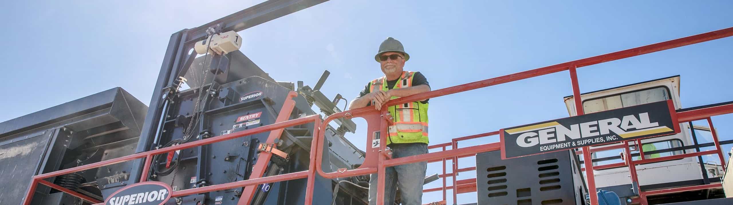 Sentry HSI mobile portable plant with operator in hardhat leaning on safety rail