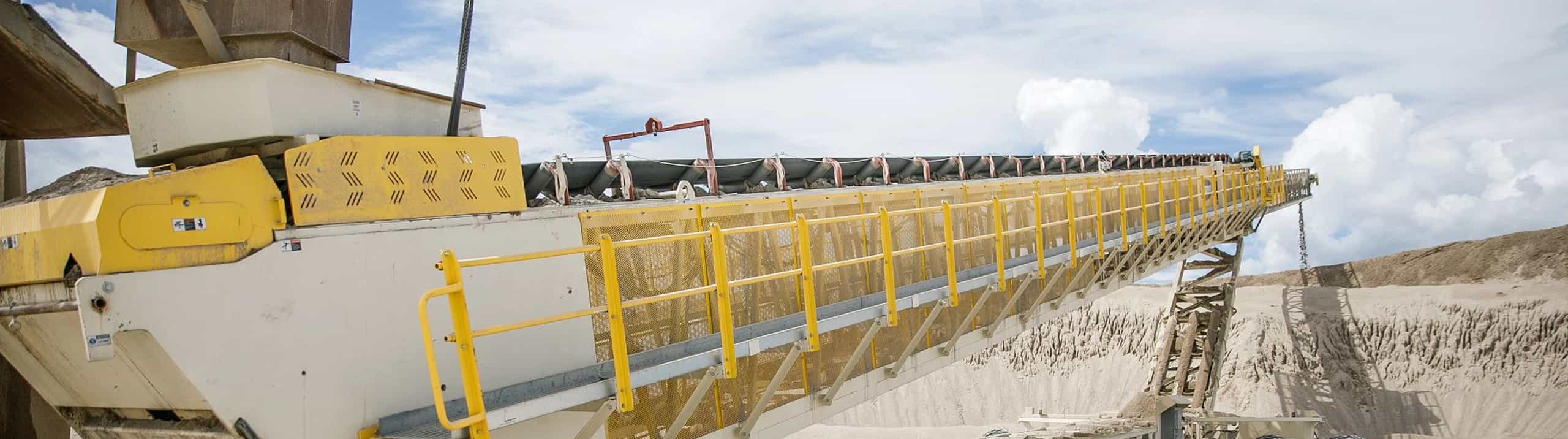 TeleStacker Conveyor with FD axle stockpiling sand at New Hampshire site