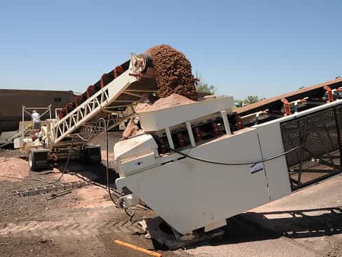 RazerTail® Truck Unloader transferring material to the tail end of TeleStacker® Conveyor