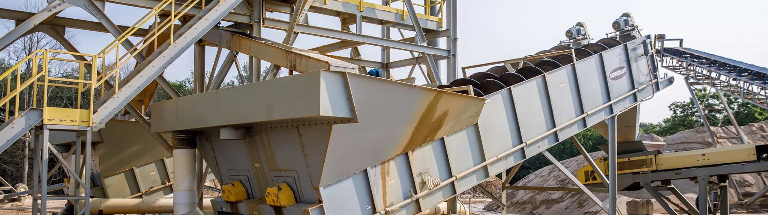 Fine materia washer in operation shown from tail end, twin screw